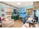 Bright bedroom with a large mural, comfortable seating and a lot of lighting at 6 Winding Ridge Rd, Casselberry, FL 32707