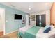 Inviting bedroom featuring natural light, carpeted floors, and a dark wardrobe for ample storage at 6 Winding Ridge Rd, Casselberry, FL 32707