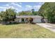 Charming home with a well-maintained front yard and inviting curb appeal on a sunny day at 6 Winding Ridge Rd, Casselberry, FL 32707