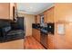 Well-equipped kitchen boasts granite countertops, stainless steel appliances, and light wood cabinets at 6 Winding Ridge Rd, Casselberry, FL 32707