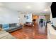 Spacious living room showcasing hardwood floors, recessed lighting, and a connected open-concept kitchen at 6 Winding Ridge Rd, Casselberry, FL 32707