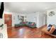 Comfortable living room featuring hardwood floors, recessed lighting, and a cozy seating area with a grey sectional sofa at 6 Winding Ridge Rd, Casselberry, FL 32707