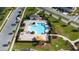 Aerial view showcases community pool with seating and cabana area at 6024 Soter Ln, Windermere, FL 34786