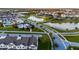 Community aerial view of a townhome community with multiple lakes and a community pool at 6024 Soter Ln, Windermere, FL 34786