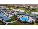 Aerial view of community featuring pool, walking paths, and pond at 6024 Soter Ln, Windermere, FL 34786