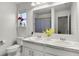 Bright bathroom featuring double sinks with granite counters and decor at 6024 Soter Ln, Windermere, FL 34786