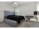 Simple bedroom with grey carpet, ceiling fan, and large dresser at 6024 Soter Ln, Windermere, FL 34786