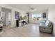 Inviting bonus room with light hardwood flooring, a TV, and large window at 6024 Soter Ln, Windermere, FL 34786