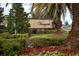 Landscaped entrance sign for the Vineyards community with lush greenery and a decorative brick base at 6024 Soter Ln, Windermere, FL 34786