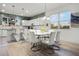 Eat-in kitchen features updated white cabinets, granite countertops, and a large dining table with seating at 6024 Soter Ln, Windermere, FL 34786