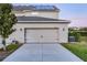 Spacious two-car garage with solar panels, enhancing curb appeal and energy efficiency at 6024 Soter Ln, Windermere, FL 34786