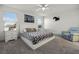 Bright main bedroom featuring a patterned bedspread, carpeting and neutral walls at 6024 Soter Ln, Windermere, FL 34786