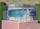 Aerial shot of screened pool and jacuzzi offering a private and luxurious outdoor space at 631 Tuscan Hills Blvd, Davenport, FL 33897