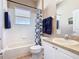 Bathroom with a vanity, sink, large mirror, toilet and shower-tub combination at 631 Tuscan Hills Blvd, Davenport, FL 33897