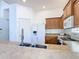Bright kitchen featuring stainless steel sink and appliances, and light wood cabinetry at 631 Tuscan Hills Blvd, Davenport, FL 33897