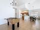 Spacious living area with a foosball table, dining room and kitchen visible at 631 Tuscan Hills Blvd, Davenport, FL 33897