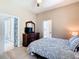 Comfortable main bedroom with ensuite access and access to the outside lanai at 631 Tuscan Hills Blvd, Davenport, FL 33897