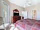 Bright main bedroom featuring private ensuite access and a view to the outdoors at 631 Tuscan Hills Blvd, Davenport, FL 33897