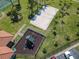 Aerial view of a sandy volleyball court and playground offering various recreational activities at 631 Tuscan Hills Blvd, Davenport, FL 33897