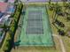 Aerial of a fenced community tennis court for active recreation and community engagement at 631 Tuscan Hills Blvd, Davenport, FL 33897