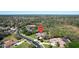 Drone view of property emphasizing location, green spaces, pool, lush surroundings, and neighborhood layout at 743 Mills Estate Pl, Chuluota, FL 32766
