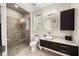 Modern bathroom with a glass-enclosed shower, granite countertops, and stylish vanity at 743 Mills Estate Pl, Chuluota, FL 32766