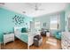Bright bedroom featuring wood floors, white furnishings, and a ceiling fan at 743 Mills Estate Pl, Chuluota, FL 32766