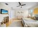 Serene bedroom with hardwood floors, a ceiling fan, and a neutral color palette at 743 Mills Estate Pl, Chuluota, FL 32766
