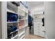 Organized walk-in closet with shelving, drawers, and hanging space for optimal storage solutions at 743 Mills Estate Pl, Chuluota, FL 32766