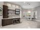 Bright dining area with modern furniture, built-in cabinets, and large windows, perfect for gatherings at 743 Mills Estate Pl, Chuluota, FL 32766