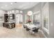 Dining area featuring modern lighting fixtures, bar area, and bright windows with outside view at 743 Mills Estate Pl, Chuluota, FL 32766