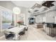 Dining area with modern table, views of the backyard pool, and open to the living area at 743 Mills Estate Pl, Chuluota, FL 32766