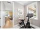 Bright exercise room with a stationary bike and a view into a bedroom at 743 Mills Estate Pl, Chuluota, FL 32766