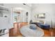 Elegant foyer with hardwood floors, decorative columns, and a stylish curved sofa at 743 Mills Estate Pl, Chuluota, FL 32766