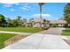 Inviting home with manicured lawn and mature trees, plus a paver driveway adding to its charm at 743 Mills Estate Pl, Chuluota, FL 32766
