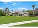 Beautiful single-story home with a well-manicured lawn, mature trees, and inviting curb appeal at 743 Mills Estate Pl, Chuluota, FL 32766