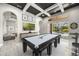 Spacious game room with a pool table, stylish decor, and access to the outdoor pool area at 743 Mills Estate Pl, Chuluota, FL 32766