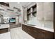Kitchen area featuring sleek cabinets, modern appliances, and stylish design elements at 743 Mills Estate Pl, Chuluota, FL 32766
