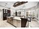 Open concept kitchen with stainless steel appliances, a large island, and plenty of natural light at 743 Mills Estate Pl, Chuluota, FL 32766