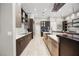 Elegant kitchen with stainless steel appliances, stylish cabinetry, and bright countertops at 743 Mills Estate Pl, Chuluota, FL 32766