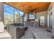 Covered lanai features an outdoor kitchen, a bar, and comfortable seating, great for entertaining at 743 Mills Estate Pl, Chuluota, FL 32766
