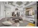 Expansive living area with modern furniture, a large sectional, and seamless indoor-outdoor flow at 743 Mills Estate Pl, Chuluota, FL 32766