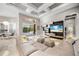 Elegant living room with coffered ceiling, large windows, and stylish furnishings, offering comfort at 743 Mills Estate Pl, Chuluota, FL 32766