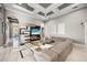 Open-concept living area with a sectional couch, modern decor, and access to other rooms at 743 Mills Estate Pl, Chuluota, FL 32766
