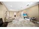 Spacious living room featuring tile floors, a comfortable sofa, and a large TV at 743 Mills Estate Pl, Chuluota, FL 32766