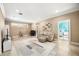Spacious living room with tile floors, a comfortable sofa, and an open doorway at 743 Mills Estate Pl, Chuluota, FL 32766