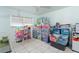 Bedroom with window showing natural light, and storage containers for organization at 7600 Boreas Dr, Orlando, FL 32822