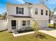 Charming two-story home with a well-manicured lawn, welcoming front porch, and a convenient two-car garage at 815 Savona Pl, Kissimmee, FL 34758