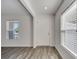 Bright entryway featuring wood-look flooring, recessed lighting and a large front door at 815 Savona Pl, Kissimmee, FL 34758