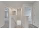 Upstairs hallway with neutral paint, carpet, and doors leading to bedrooms for easy access at 815 Savona Pl, Kissimmee, FL 34758
